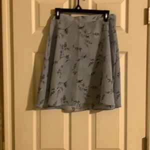 Baby blue mid skirt w/floral designs size 11/12